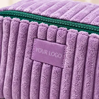 Woven label logo on a makeup bag